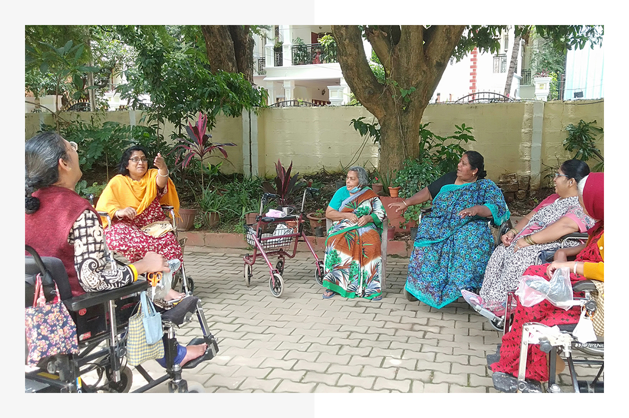 Cheshire Homes  |  What we do - Residents enjoying a moment in the garden, July 2022